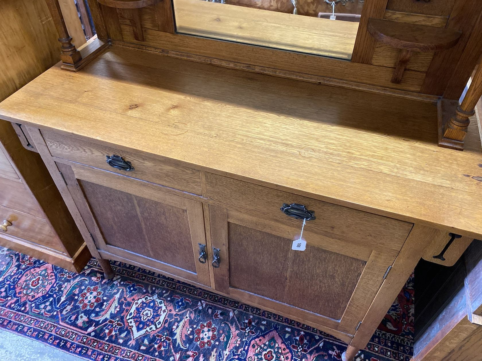 An early 20th century Art Nouveau oak mirrored back sideboard, length 137cm, width 52cm, height 172cm